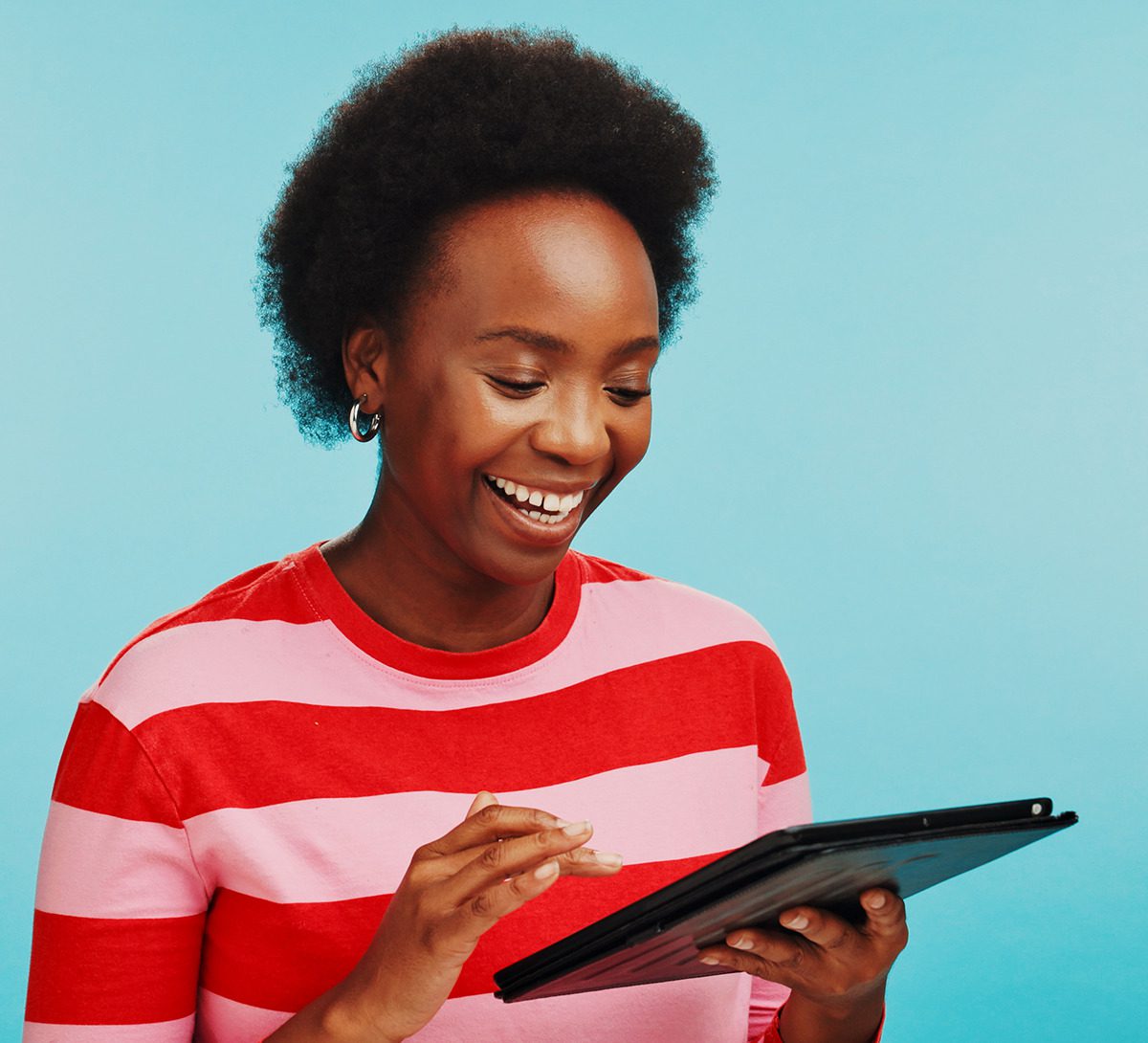 Person in striped shirt with tablet